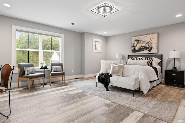 bedroom with light hardwood / wood-style floors