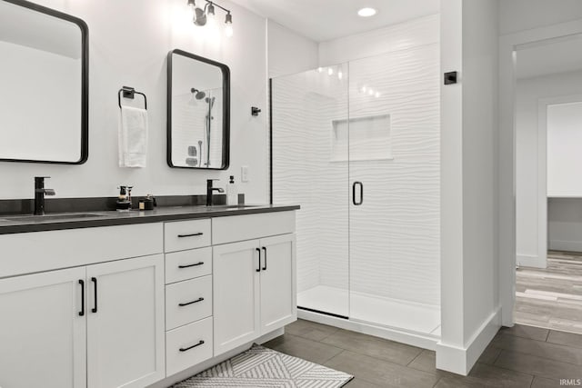 bathroom with vanity and walk in shower