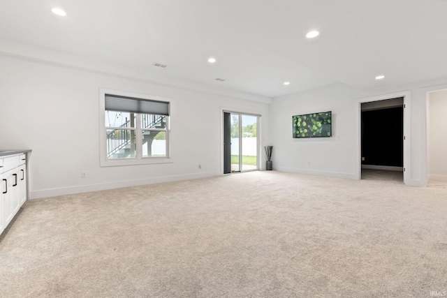 empty room with light colored carpet