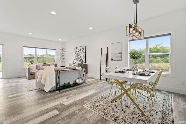 dining room featuring a chandelier and light hardwood / wood-style flooring