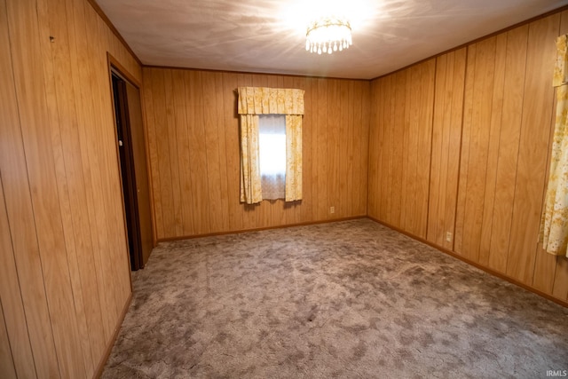 carpeted spare room with ornamental molding