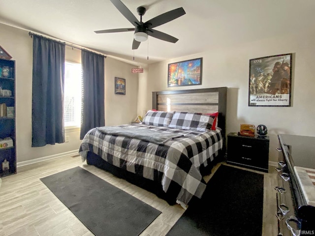 bedroom featuring ceiling fan and light wood-type flooring