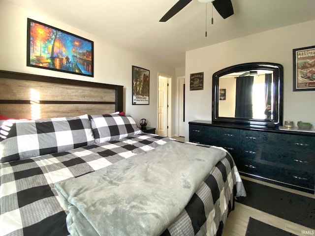 bedroom featuring light wood-type flooring and ceiling fan