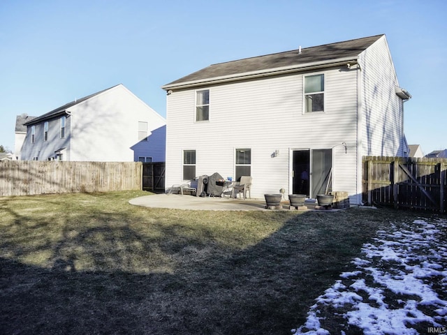 back of property featuring a patio and a lawn