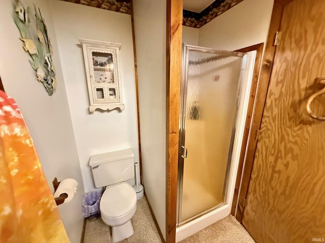 bathroom with toilet and walk in shower