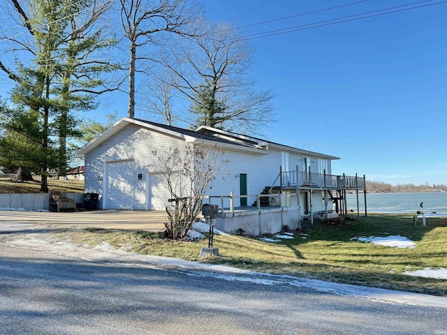 view of home's exterior featuring a yard and a garage