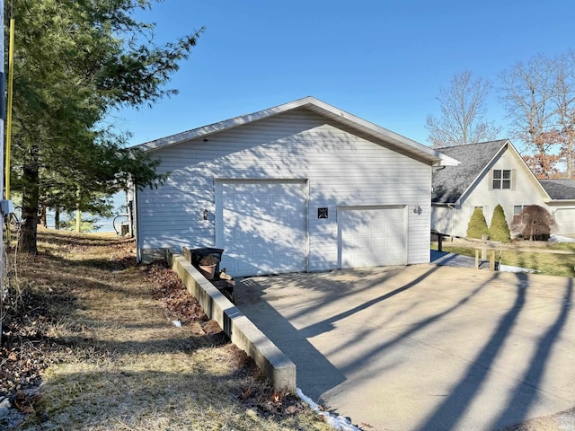 rear view of house featuring a garage