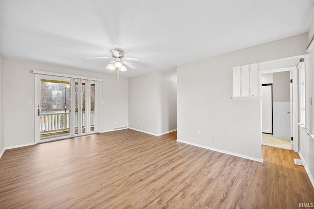 spare room featuring ceiling fan and light hardwood / wood-style flooring