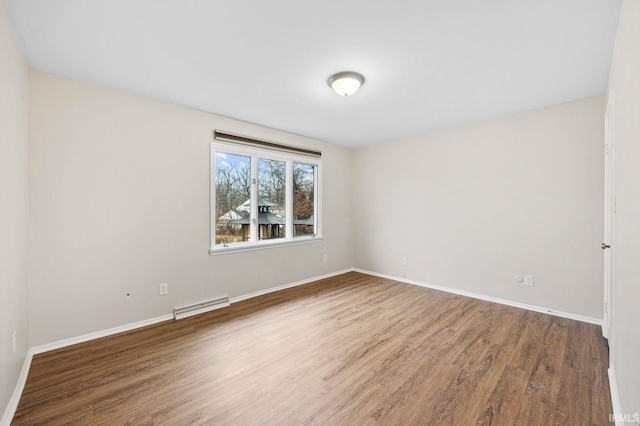 unfurnished room featuring wood-type flooring