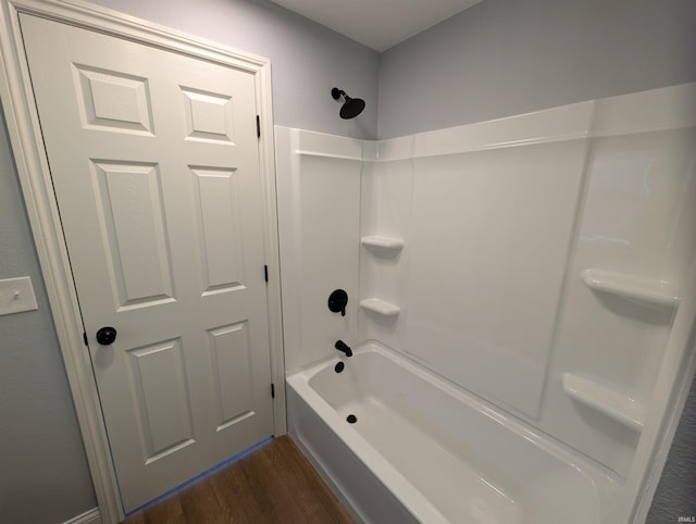 bathroom featuring hardwood / wood-style floors and shower / bathing tub combination