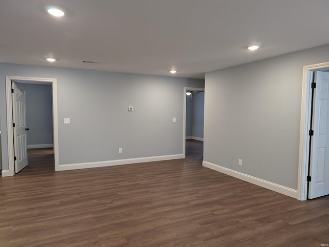 unfurnished room with dark hardwood / wood-style floors