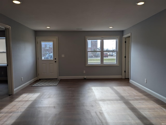 foyer entrance featuring light hardwood / wood-style floors and a wealth of natural light