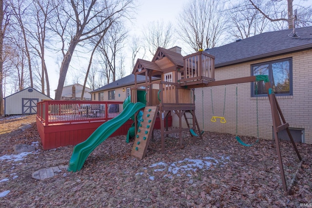 view of jungle gym with a storage shed