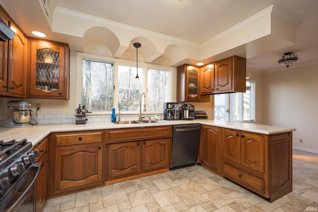 kitchen featuring black stove, sink, dishwasher, kitchen peninsula, and pendant lighting