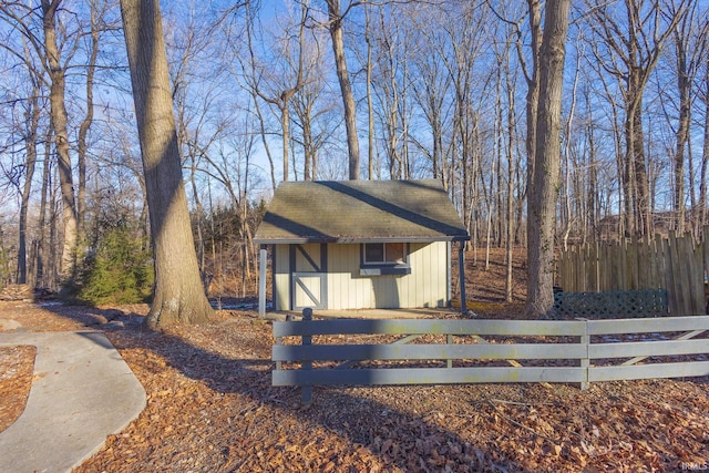 view of front of home with a shed