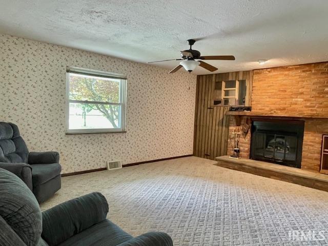 living room with carpet and a textured ceiling