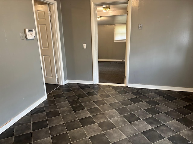 interior space featuring dark tile patterned flooring