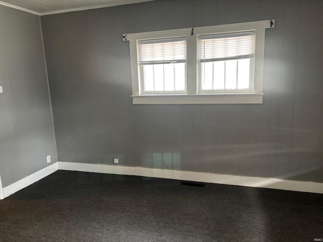 spare room featuring ornamental molding