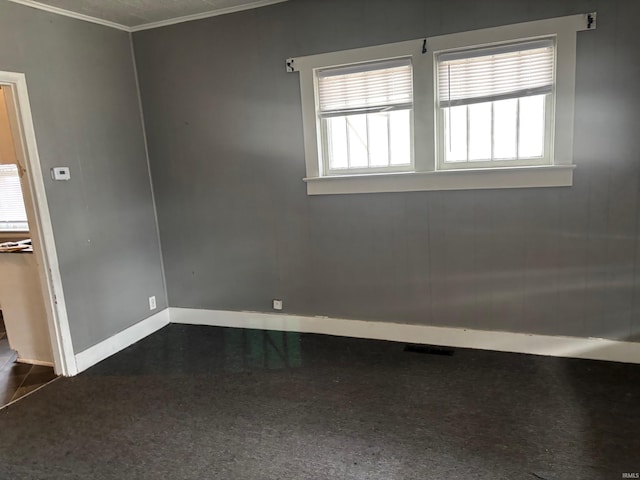 unfurnished room featuring ornamental molding