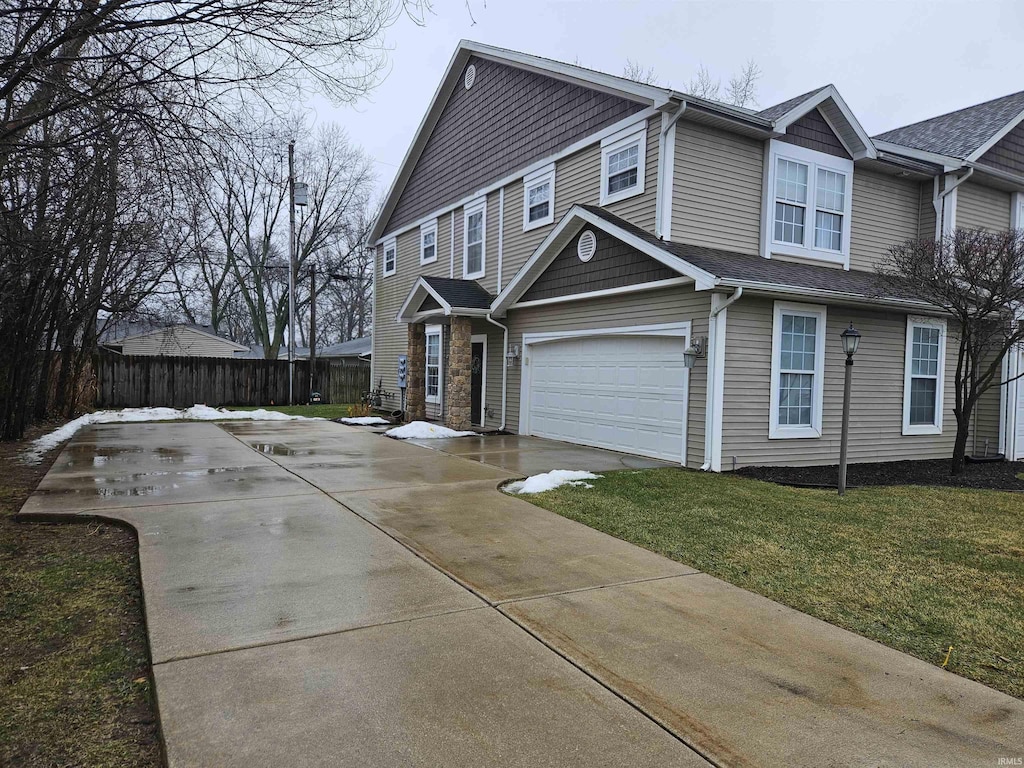 view of front of house with a garage and a front yard