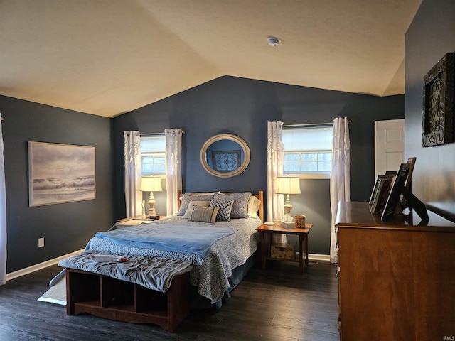 bedroom with lofted ceiling and dark wood-type flooring