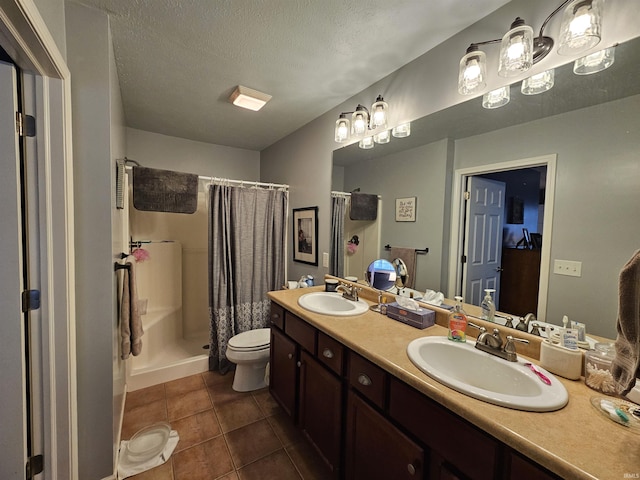 bathroom featuring vanity, walk in shower, toilet, tile patterned floors, and a textured ceiling