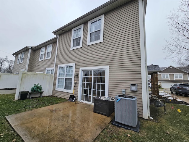 back of property featuring central AC unit and a patio area