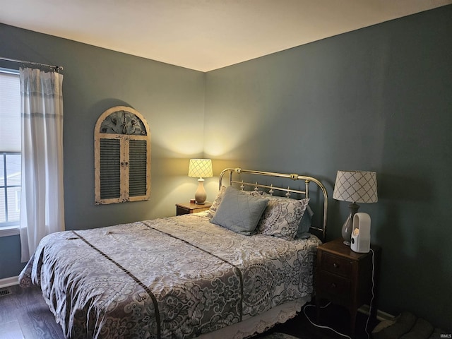 bedroom with wood-type flooring