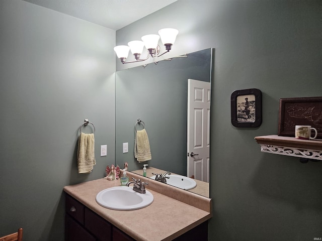 bathroom featuring vanity and a notable chandelier