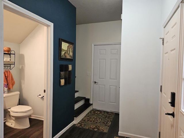 bathroom with wood-type flooring and toilet