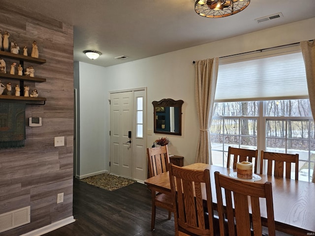 dining area with dark hardwood / wood-style flooring