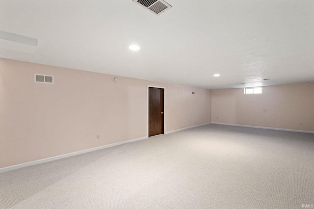 basement with light colored carpet