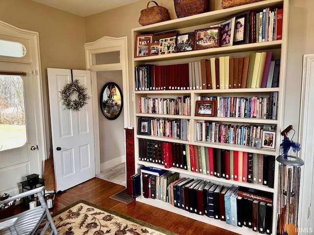 sitting room with dark hardwood / wood-style flooring