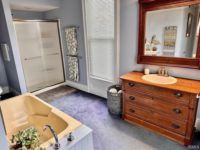 bathroom featuring vanity and shower with separate bathtub