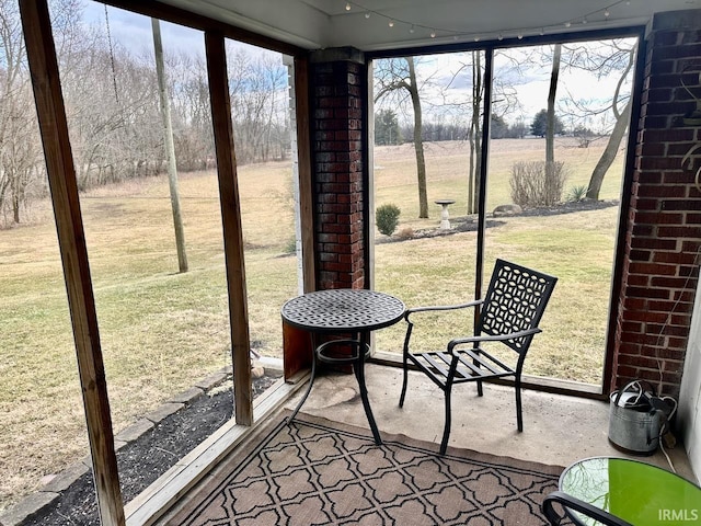 sunroom / solarium with a rural view