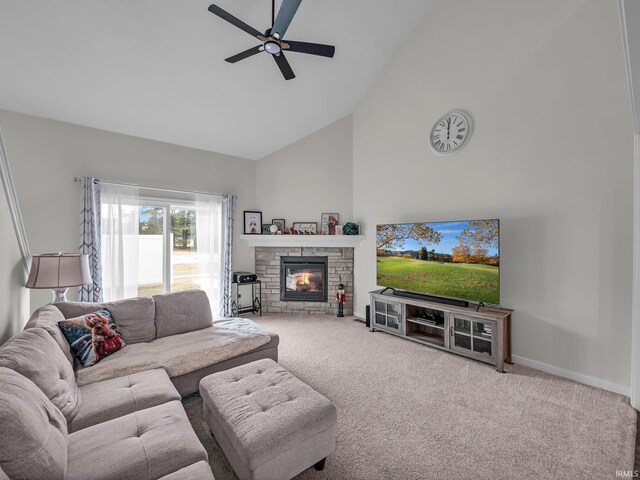 living room with a stone fireplace, high vaulted ceiling, ceiling fan, and carpet flooring