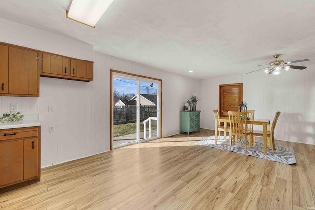 dining room featuring ceiling fan and light hardwood / wood-style floors