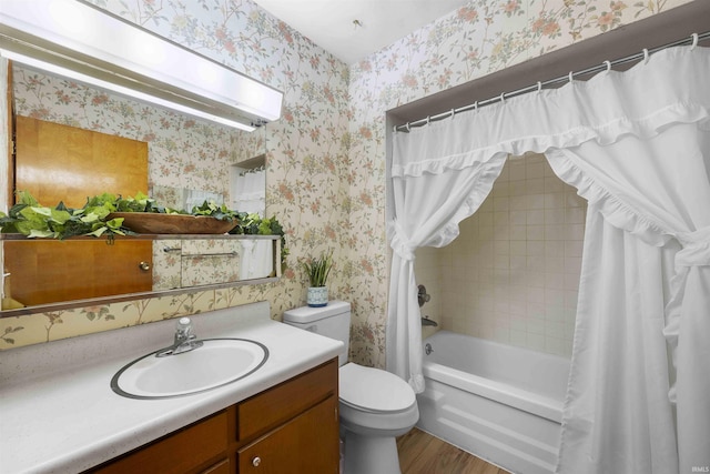 full bathroom featuring shower / bathtub combination with curtain, vanity, hardwood / wood-style floors, and toilet