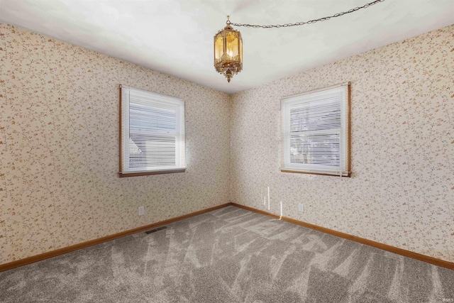 unfurnished room featuring carpet floors