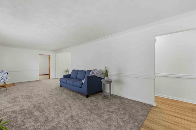 sitting room featuring crown molding and wood-type flooring