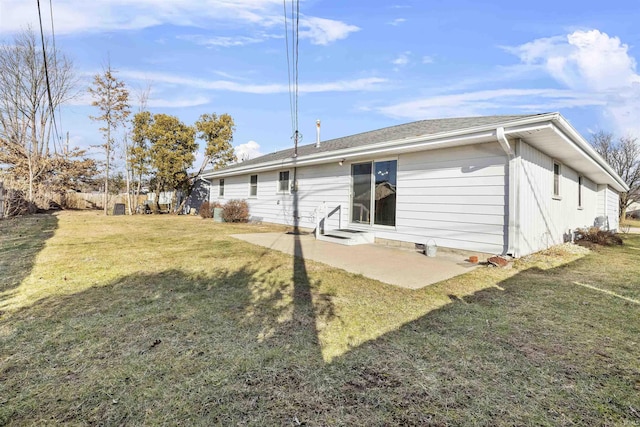 back of house featuring a yard and a patio area