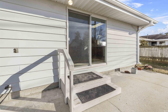 entrance to property featuring a patio area