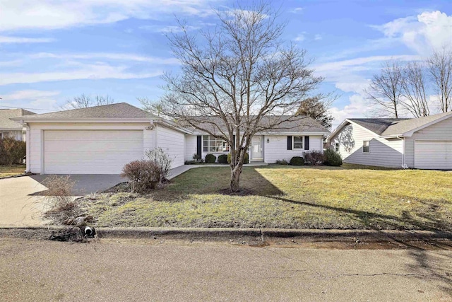 ranch-style home with a garage and a front lawn