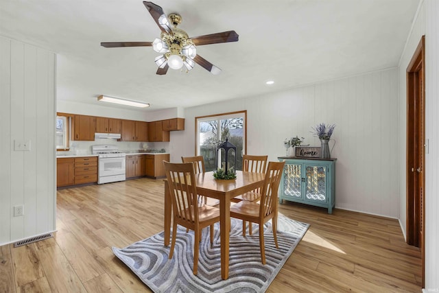 dining room featuring ceiling fan and light hardwood / wood-style floors