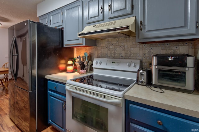 kitchen with blue cabinets, tasteful backsplash, light hardwood / wood-style flooring, electric range, and black refrigerator