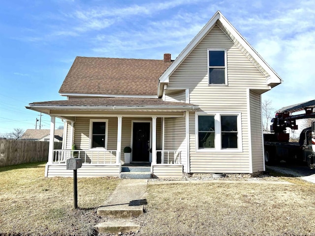 front facade featuring a porch and a front yard