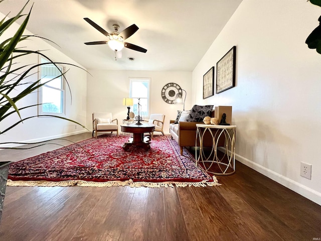 living room with hardwood / wood-style flooring and ceiling fan