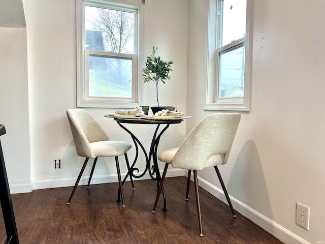 dining room with dark wood-type flooring