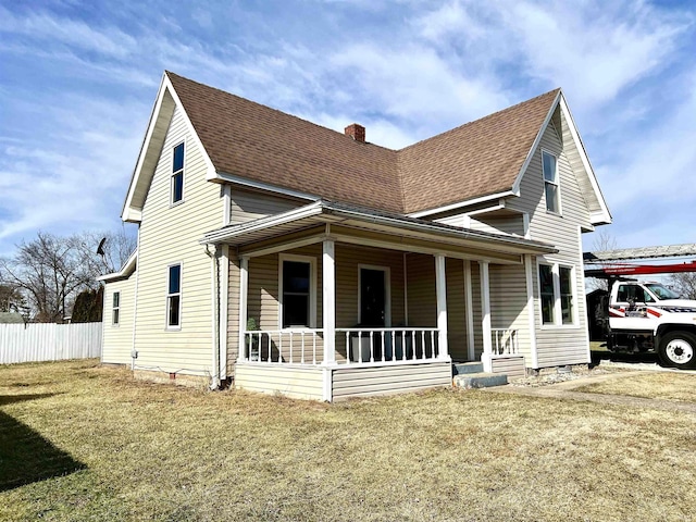 view of front property with a porch and a front yard