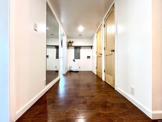 hall featuring a barn door and dark hardwood / wood-style flooring